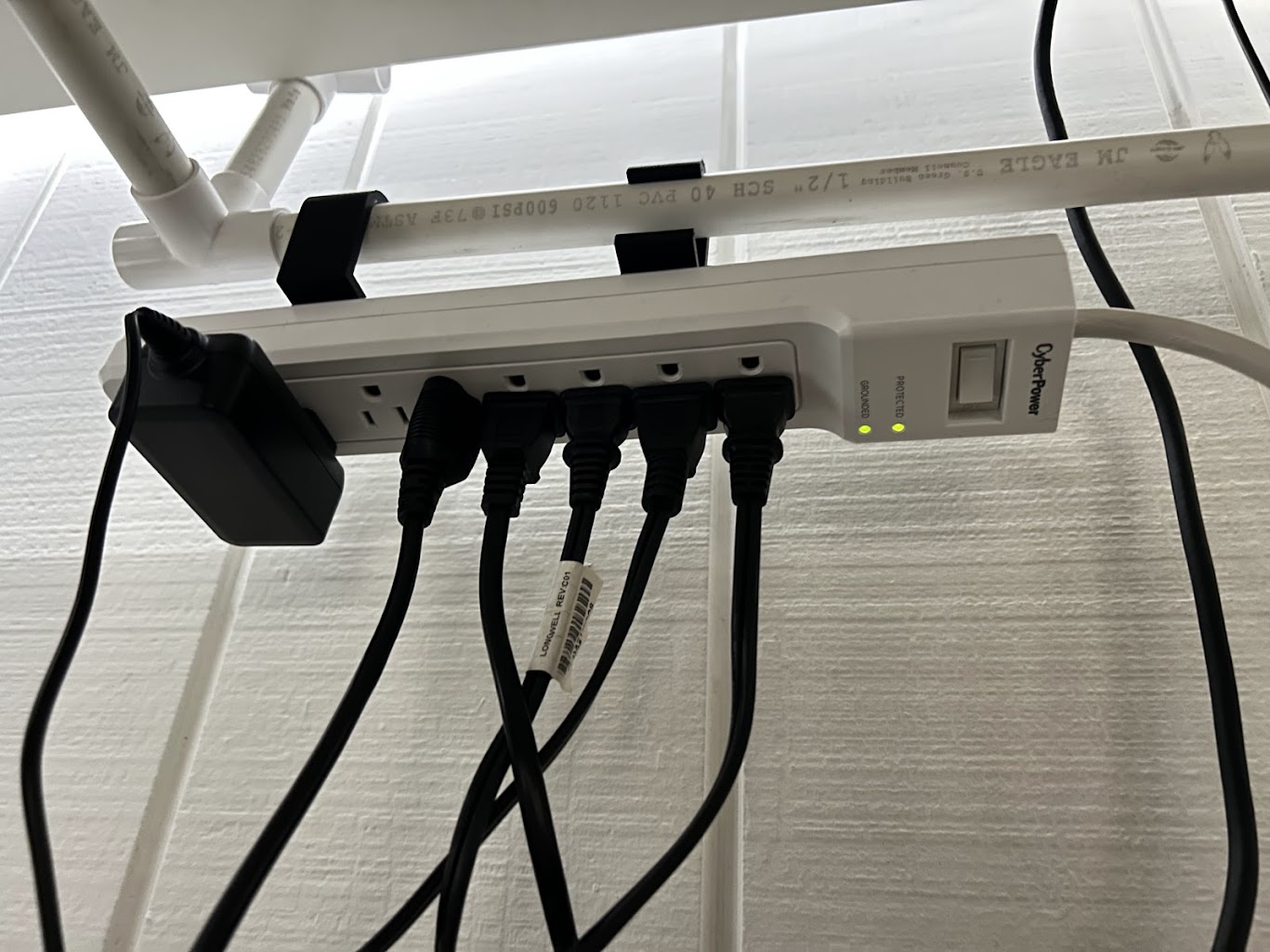 Underdesk surge protector holder